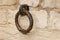 Rusty old ring at a brickwork wall