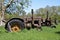 Rusty old tractors lined up.