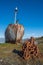 Rusty old whaler chained to iron post