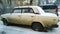 Rusty old white car VAZ 2105 or Lada Classic brand Riva or Nova in Europe covered snow. Popular legendary Russian auto