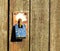 Rusty padlock on a wooden barn door