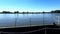 Rusty pier for big ships on danube river with blue sky and water