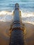 Rusty pipe on beach