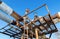 Rusty pipeline with valves against the blue sky background