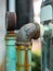 Rusty pipes of water pump Out door, After many years of operation corroded metal pipe was destroyed