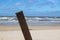 Rusty pole on beach