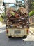 A rusty poor kombi in terrible conditions collecting recyclabes.