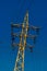 Rusty power-tower with many wires and glass insulators dutch angle shot