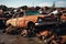 Rusty remnants junkyard filled with old cars, highlighting environmental pollution