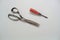 The rusty scissors and screwdriver utensil