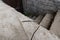 Rusty screws on concrete surface near the stone staircase