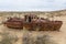 Rusty ship at the ship graveyard in former Aral sea port town Moynaq Mo ynoq or Muynak , Uzbekist