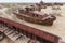 Rusty ships at the ship graveyard in former Aral sea port town Moynaq Mo ynoq or Muynak , Uzbekist