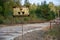 Rusty sign with the inscription: caution, radiation, concrete road, exclusion zone,