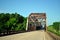 Rusty Steel Truss Covered Bridge