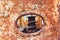 Rusty submarine armoured porthole or window metal background.