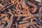 Rusty tangled chains lie in the port. Background. Metal corrosion