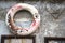 Rusty Textured Old Wall With Frames and one safety life buoy