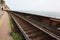 Rusty tracks of a train transport path of a lonely railway where nobody is there