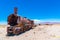 Rusty train in the famous train cemetry at Salar de Uyuni