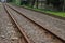 Rusty train tracks with pebbles in Indonesia railways