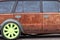 Rusty tuned car with green fashion wheel, ussr automobile industry