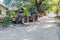 Rusty vehicles on a dusty street in Mandalay, Myanm