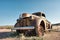 Rusty vintage car in desert