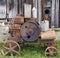 Rusty  vintage  small  tractors  diesel engine  and retrol machinery near the rural wooden  barn