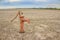 Rusty water pump on land.