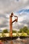 Rusty water tap in sunset light against dramatic skies