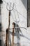 Rusty well used garden fork, scythe and hoe on the grunge wall