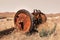 Rusty wheels on old farm equipment in the middle of prairies