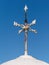 Rusty White Cardinal Direction or Direction pointer Sign against blue sky