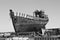 Rusty wooden and metal shipwreck in the Icelandic dry dock in the Akranes town as a symbol of corrosion and decay