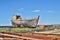 Rusty wooden and metal shipwreck in the Icelandic dry dock in the Akranes town as a symbol of corrosion and decay