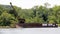 Rusty wreckage of a barge with a tracked crane on top, Kingston, NY