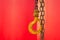 Rusty Yellow Hook and chains with red background