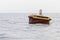 Rusty yellow mooring buoy with seagulls