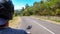 Ruteng - A man driving a scooter on an empty road