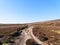 Rutted and rock strewn footpath winds up Derwent Moor in Derbyshire.