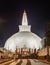 Ruwanwelisaya stupa glowing in the night, it is a hemispherical structure and containing sacred Buddha`s relics built by King