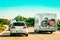 RV Camper with bicycles and car on Road