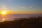 RV Campers On the Beach At Sunset