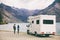 RV motorhome camper van road trip young people on New Zealand travel vacation adventure, Two tourists looking at lake and