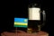 Rwanda flag with beer mug on black