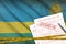 Rwanda flag and Health insurance claim form with covid-19 stamp. Coronavirus or 2019-nCov virus concept