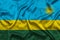 Rwanda national flag background with fabric texture. Flag of Rwanda waving in the wind. 3D illustration