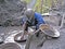 Rwandan Miner Panning For Precious Metals