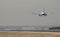 Ryanair jet airliner approach to land at Madrid airport runway, seen from behind